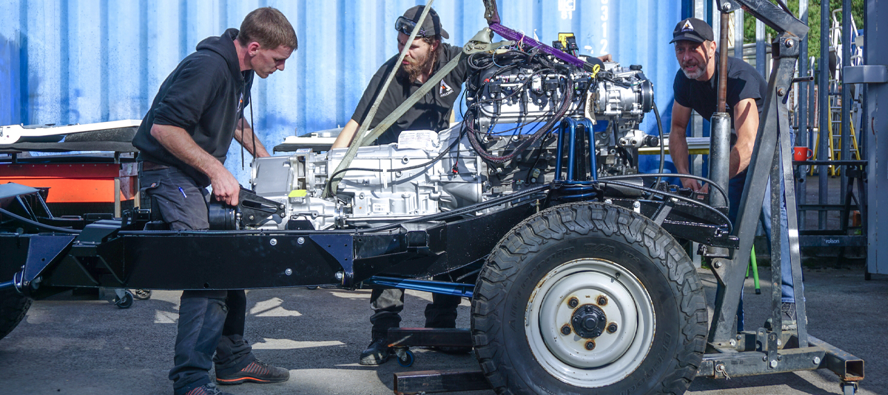 A Defender chassis with LS3 Corvette engine being fitted