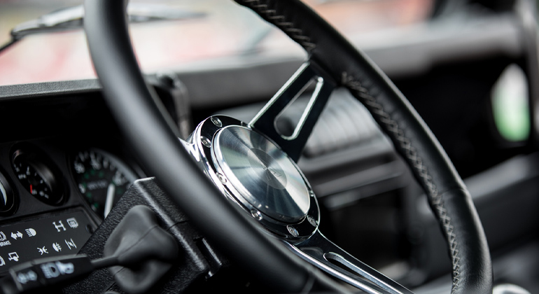Arkonik steering wheel with silver spokes and black leather trim