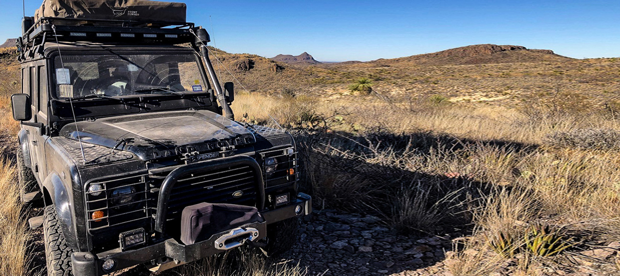 Land Rover Defender parked in Texas desert