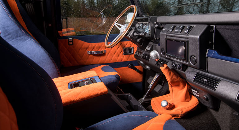 Defender interior with Blue Alcantara and Orange suede upholstery