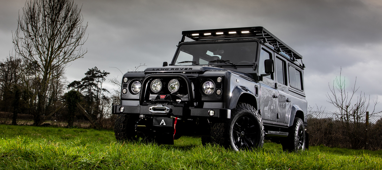 Front view of Bonatti Grey Defender 110 parked in a field