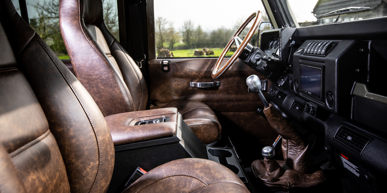 Interior view of Defender front seats and steering wheel