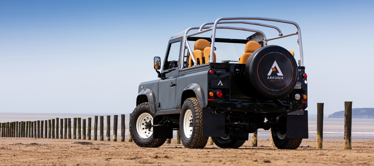 Rear view of 	Java Black Defender 90 on the beach