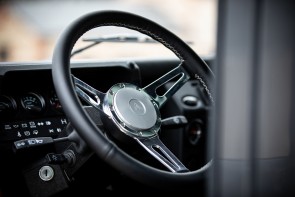 KAIROS D110 interior showing the leather steering wheel