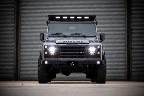 Front view of KAIROS Defender 110 with headlights lights on