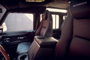 Defender front seats in black leather with Defender lettering. 