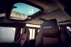 Interior suede headlining with sun rood in a Defender 110.