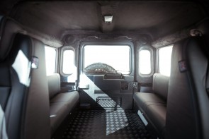 Internal view of load area inside a D110 with bench seats.