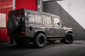 GOTHAM D110 by Arkonik parked outside garages.
