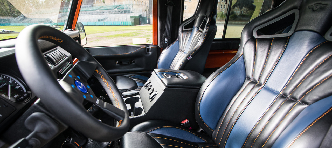 Defender interior with blur and black leather upholstery