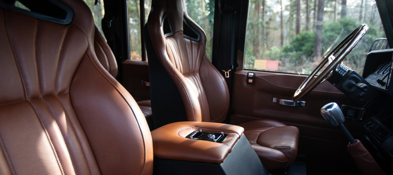 Interior view of Defender front seats in brown leather