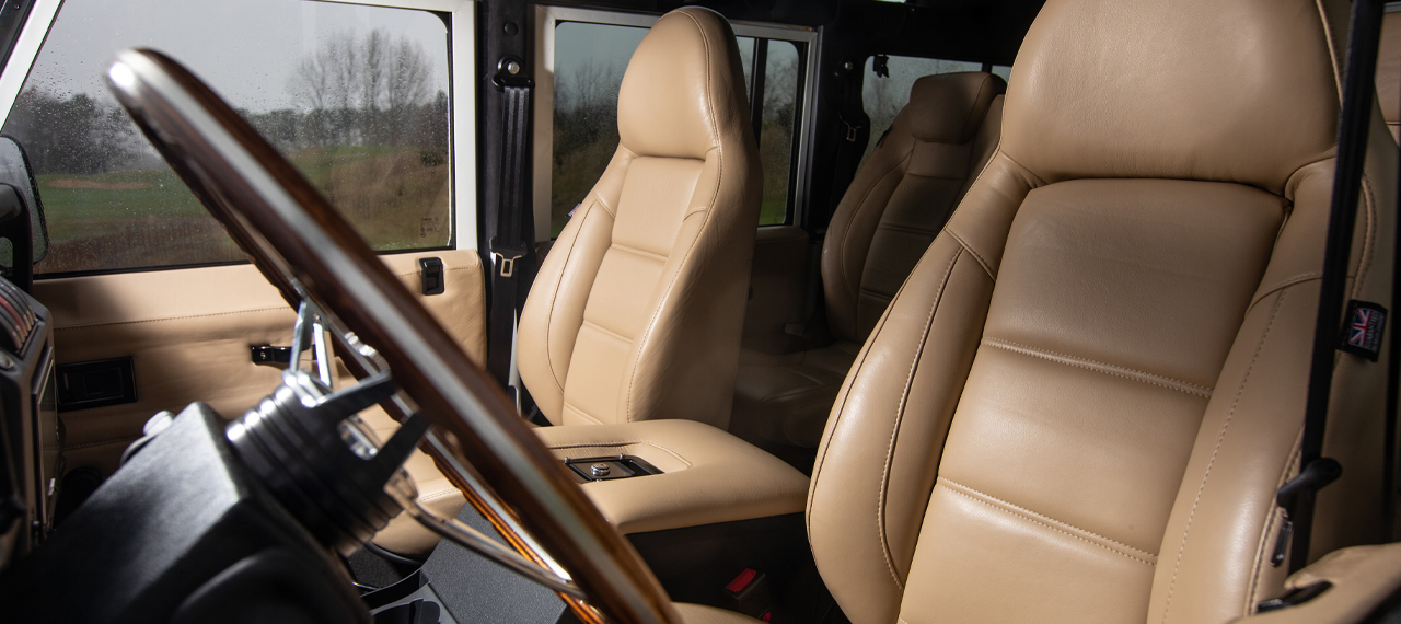 Cream leather modular seats inside a Defender