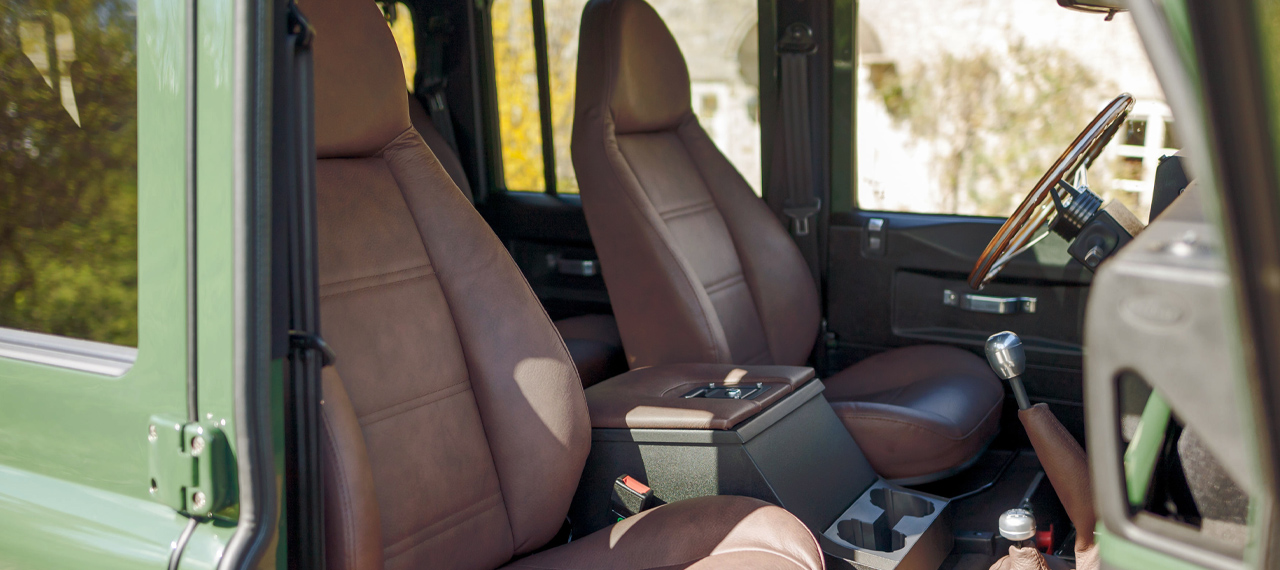 Interior view of DROGO D110 brown leather modular front seats