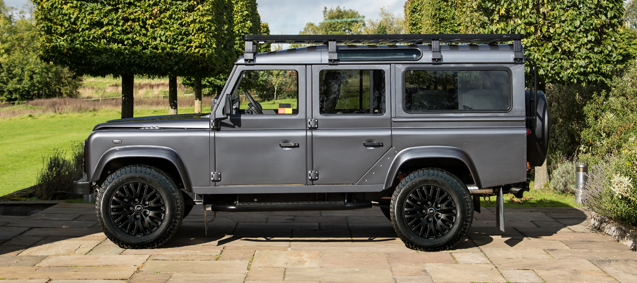 Side view of an Arkonik Bonatti Grey Land Rover Defender for sale