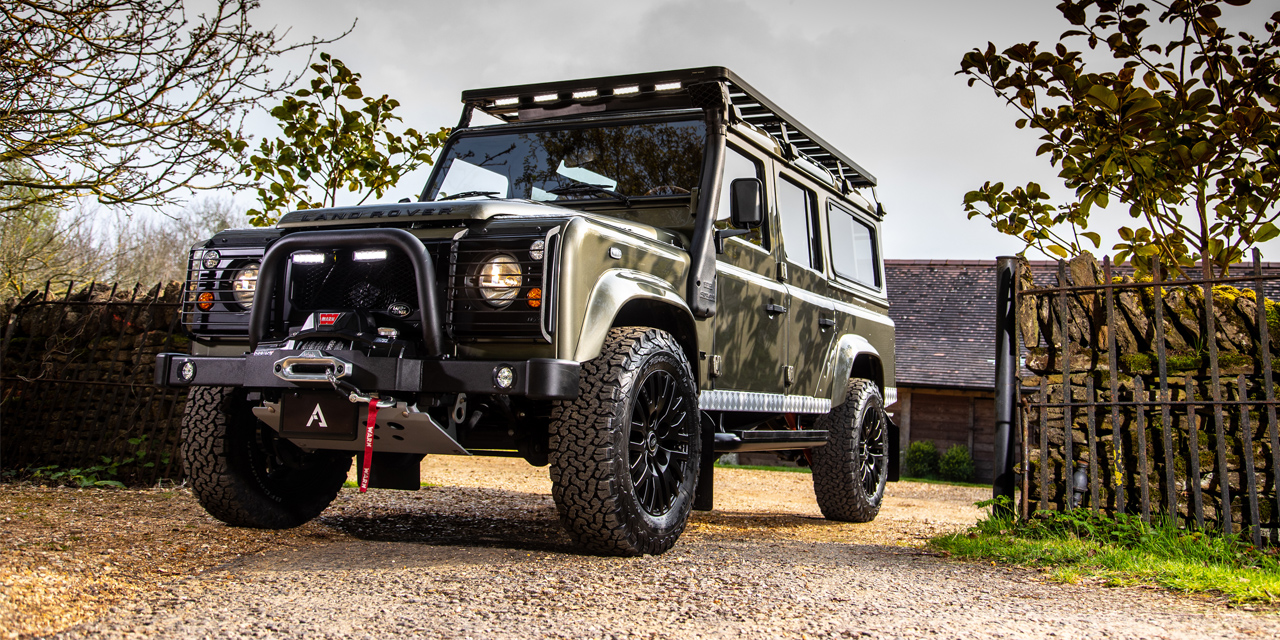 Front view of a D110 with WARN winch and Frontrunner roofrack