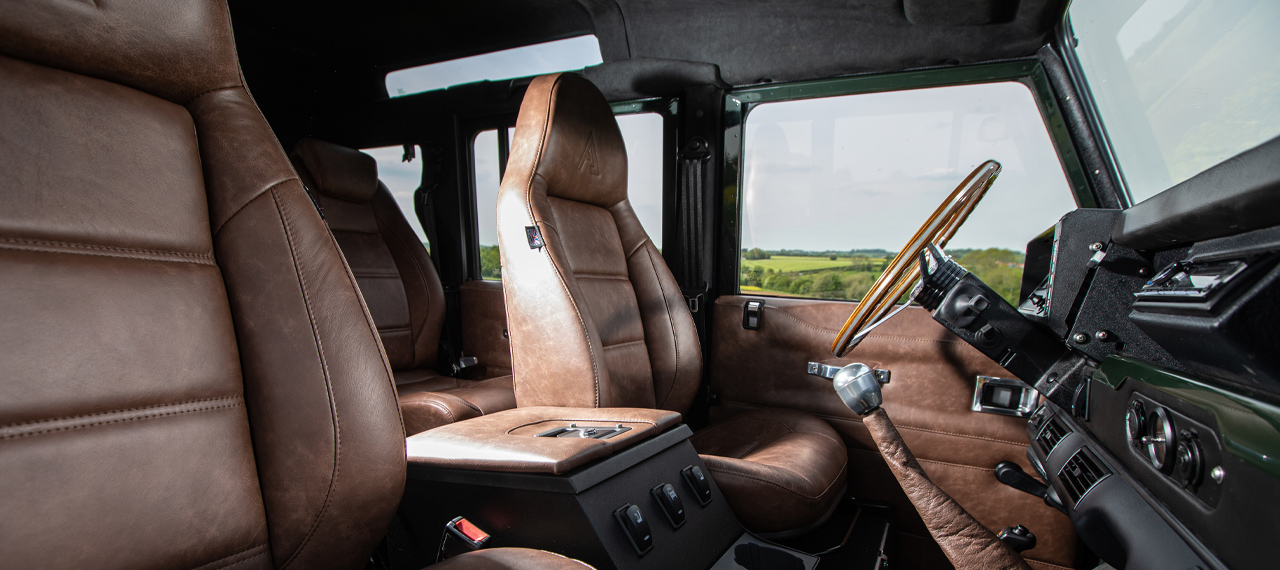 Brown leather interior front seats of OMEGA Defender 110