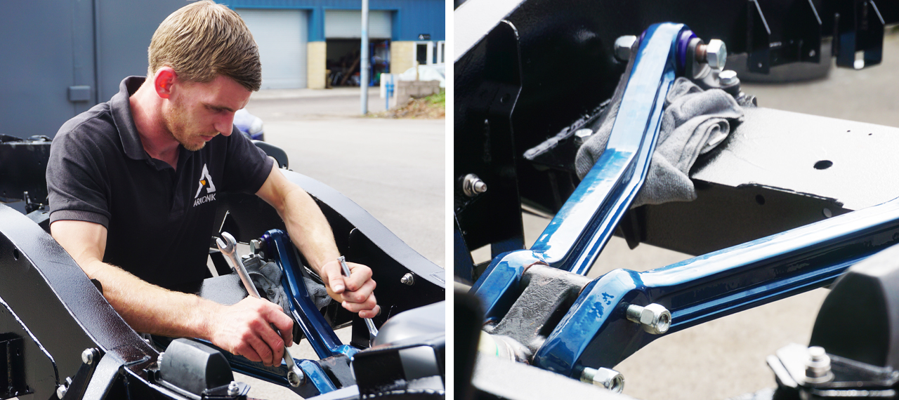 Arkonik team member fitting A-frame arms to Defender chassis